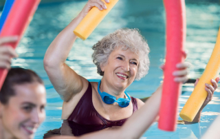 Senior Womanin Water Aerobicsin Pool