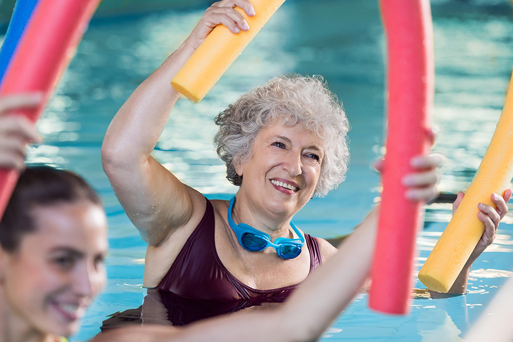 Senior Womanin Water Aerobicsin Pool